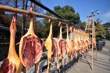Rows of cured meat hanging to dry