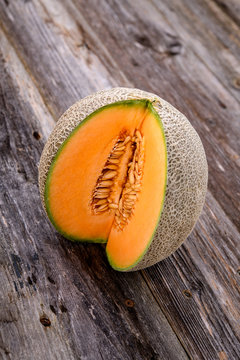 cantaloupe melon on wooden ground