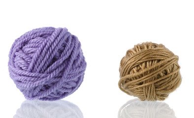 Yarn for handwork and knitting. Set on a white background with reflection.