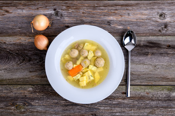 marrow balls soup in white plate from above