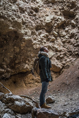 Man traveling with backpack hiking in mountains