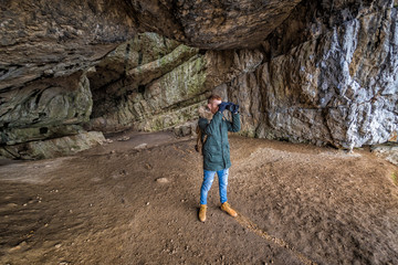 Man traveling with backpack hiking in mountains