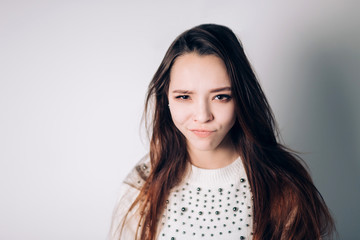 Fototapeta premium Portrait of funny emotional girl on blue background