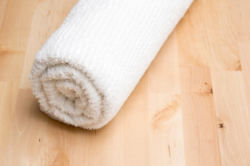 Obraz na płótnie Canvas Towel and wooden table