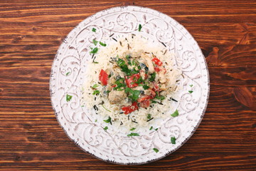 Fried chicken breasts pieces with steamed vegetables served with
