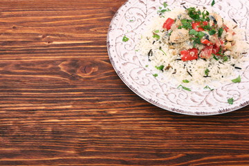 Fried chicken breasts pieces with steamed vegetables served with
