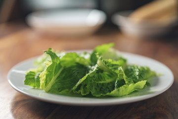 romaine lettuce on white plate closeup