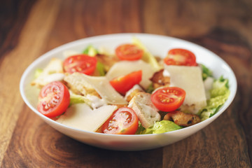 caesar salad with cherry tomatoes closeup