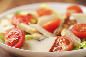 caesar salad with cherry tomatoes closeup