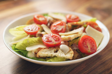 caesar salad with cherry tomatoes closeup