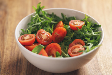 fresh salad with cherry tomatoes and arugula