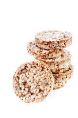 Round wheat crispbread, white background. Composition of crispbread on white background.