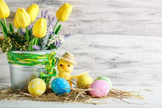 Happy Easter. Congratulatory easter background. Easter eggs and chick.