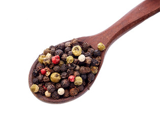 spices in the spoons isolated on white