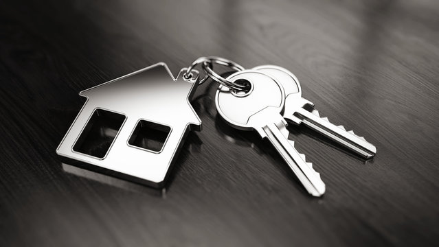 Key to a new home concept - House keys with trinket house on wooden background. 3d rendering