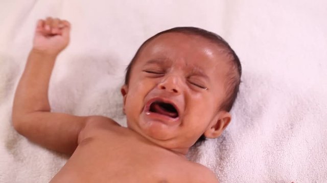 Newborn baby boy crying 