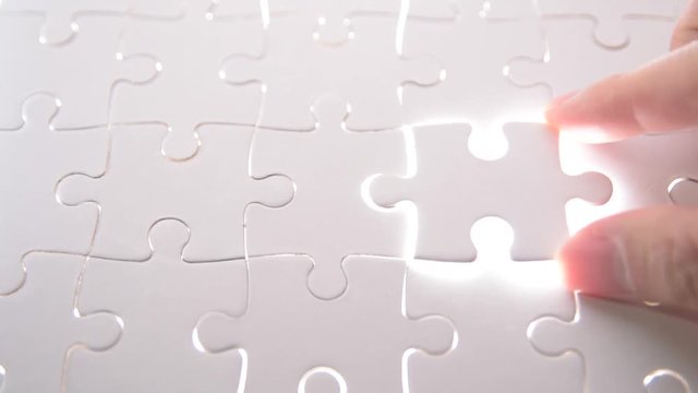  jigsaw puzzle piece with light glow, business concept for completing the final puzzle piece.
