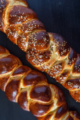 tasty challah on a wooden background
