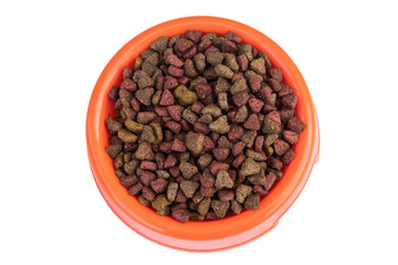 Dry cat food in orange bowl. Pet food isolated on white background. Top view