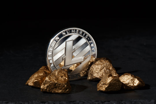 Silver Bitcoin Coin and mound of gold. Bitcoin cryptocurrency. 