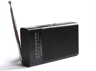 small portable black radio receiver on a white background