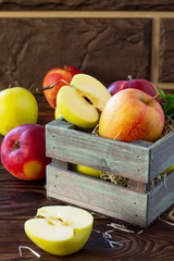 Fresh and juicy apples on a wooden table. Still life, diet and nutrition concept.
