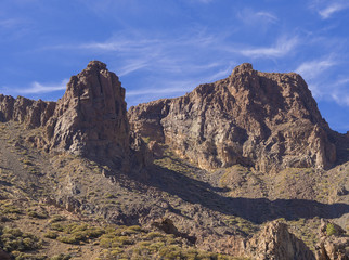 view on famous rock formation cathedral in Roques de Garcia and colorful volcanic mountain and lava desert on tenerife canary island unesco protected landscape, blue sky background