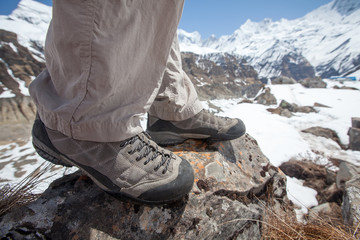 Trekking shoes in mountains closeup