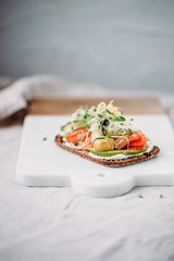 Smorrebrod - danish open sandwich with fish, herring, avocado