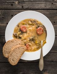 Slovak christmas cabbage soup with mushrooms on natural background.