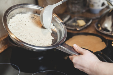 liquid dough is poured onto frying pan