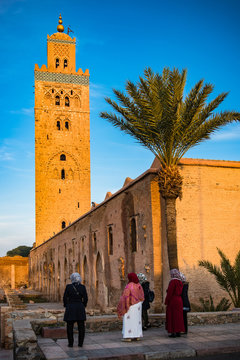 Muslim woman looking at Koutoubia Mosque,Morocco