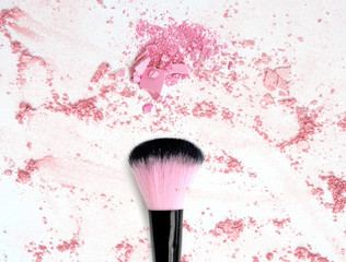 Blush make up powder on crushed pink powder cosmetic.