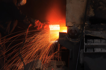 The workshop welder cuts metal