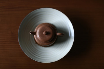 Dark-red enameled pottery teapot