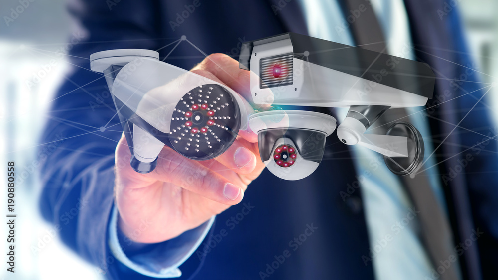 Poster businessman holding a security camera system and network connection - 3d rendering