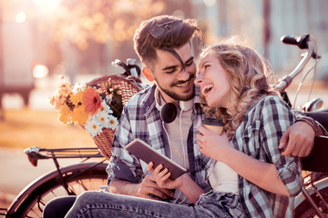 Couple in love enjoy together on a bench