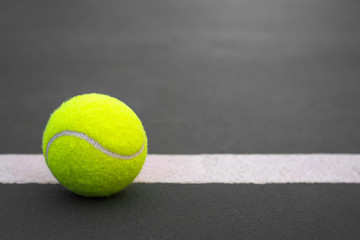Close up Tennis ball on court background with copy space