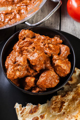Chicken tikka masala served with bread naan