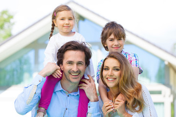 Happy family and their house