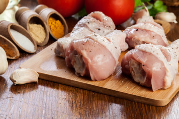 Raw chicken legs with spices