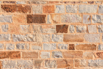 Colorful natural stone wall texture background.