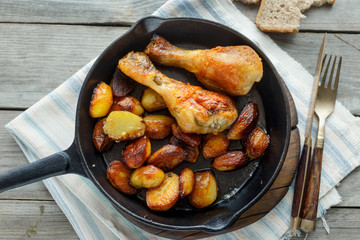 Fried chicken legs, fried potatoes, top view