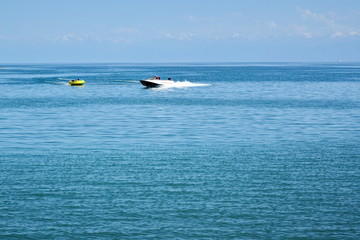 people ride on a motor boat in the sea Bay