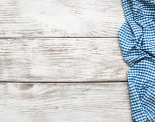 Checkered napkin on a wooden background