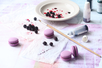 Obraz na płótnie Canvas Purple Macarons with Chocolate Black Currant Filling, on light background.