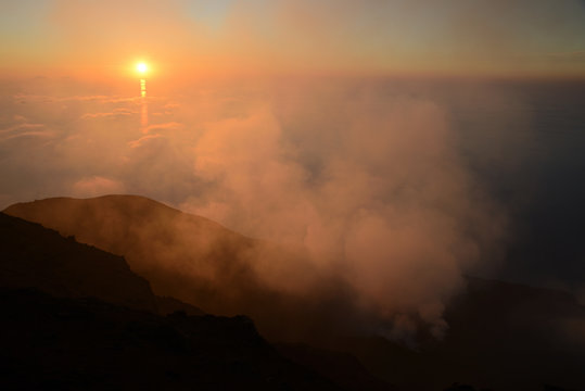 Spectacular sunset over the Aeolian Islands seen from the summit of Volcano Stromboli, Sicily, Italy