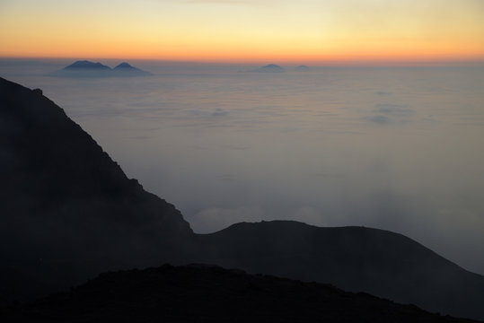 Spectacular sunset over the Aeolian Islands seen from the summit of Volcano Stromboli, Sicily, Italy