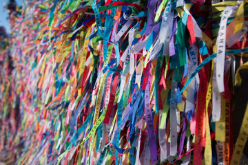 Colorful ribbons on the grid in front of Bonfim church in Salvador, Bahia, Brazil