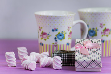 gift box with a bow on a pink wooden background